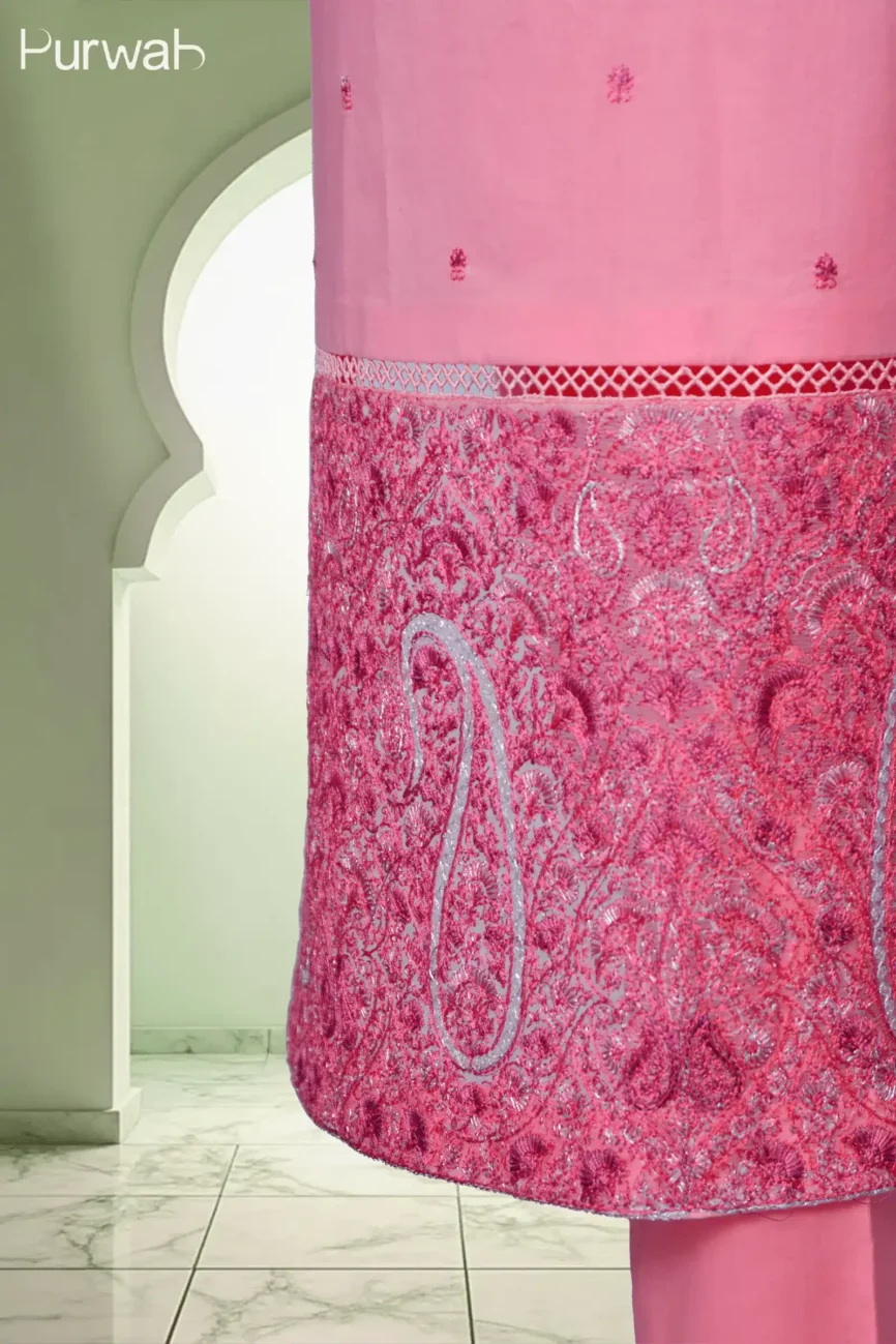 The lower section of the pink kurta, with detailed embroidery at the hem, showcasing the beautiful design and fine craftsmanship.