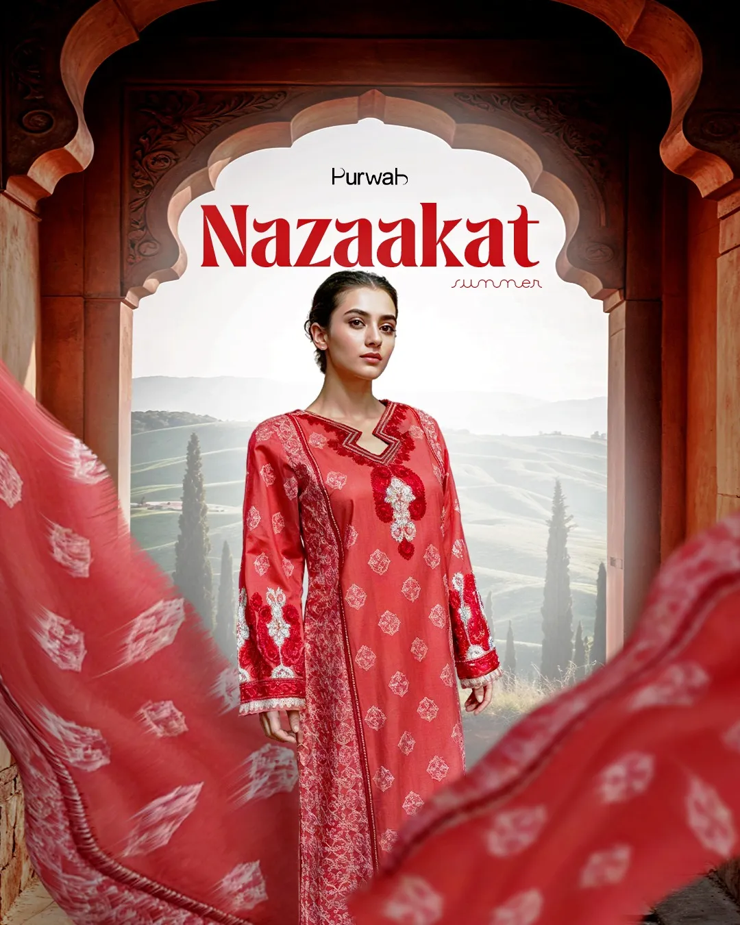 Model showcasing an orange embroidered dress paired with matching pants, highlighting the elegant design.